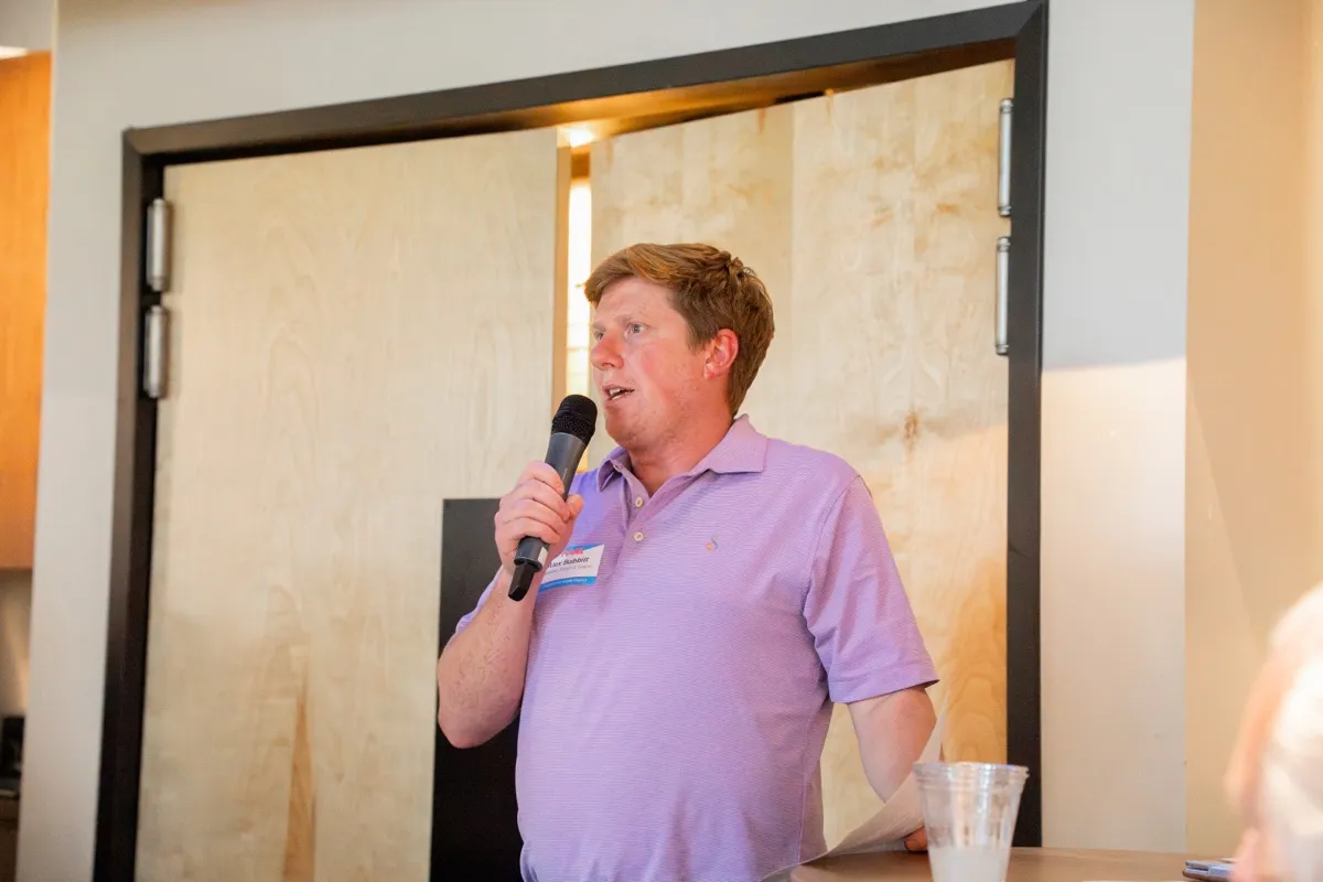 A speaker addressing the room at the IWA kickoff