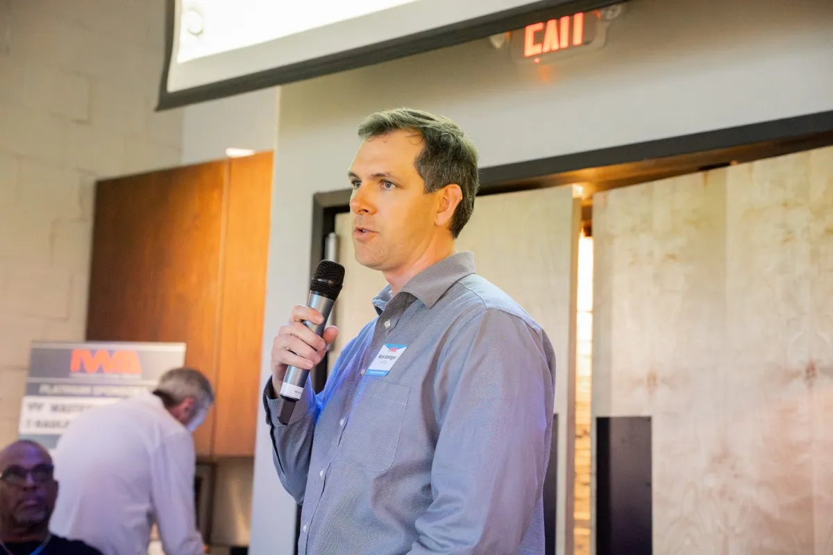 An attendee asking a question at the mic