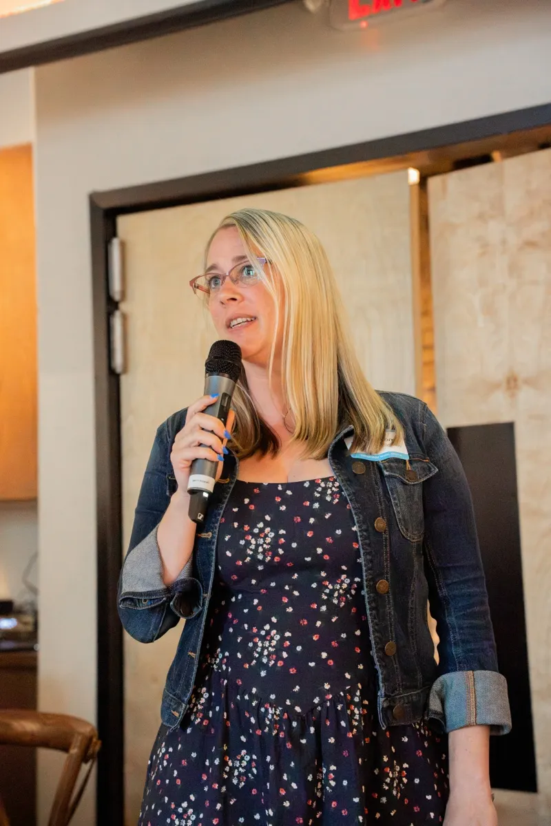 A speaker addressing the room at the IWA kickoff