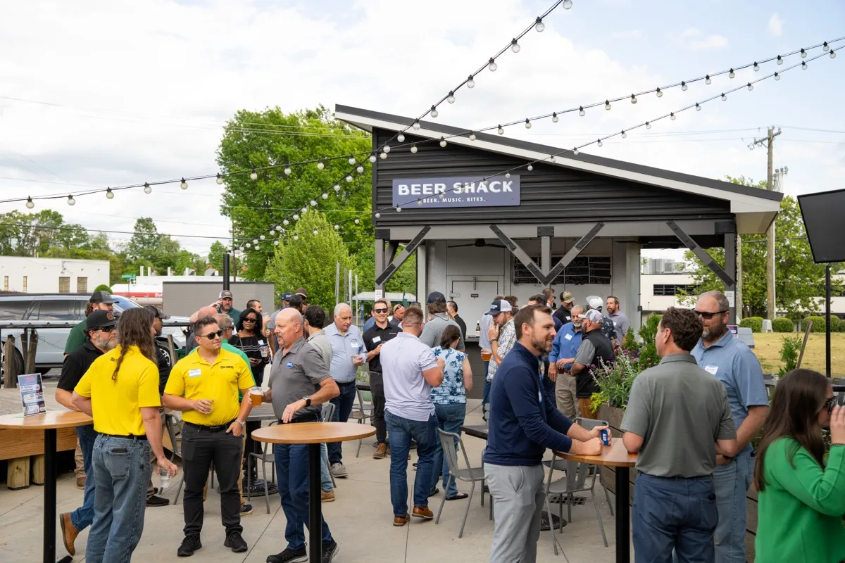 Outdoor networking under the Beer Shack at the kickoff