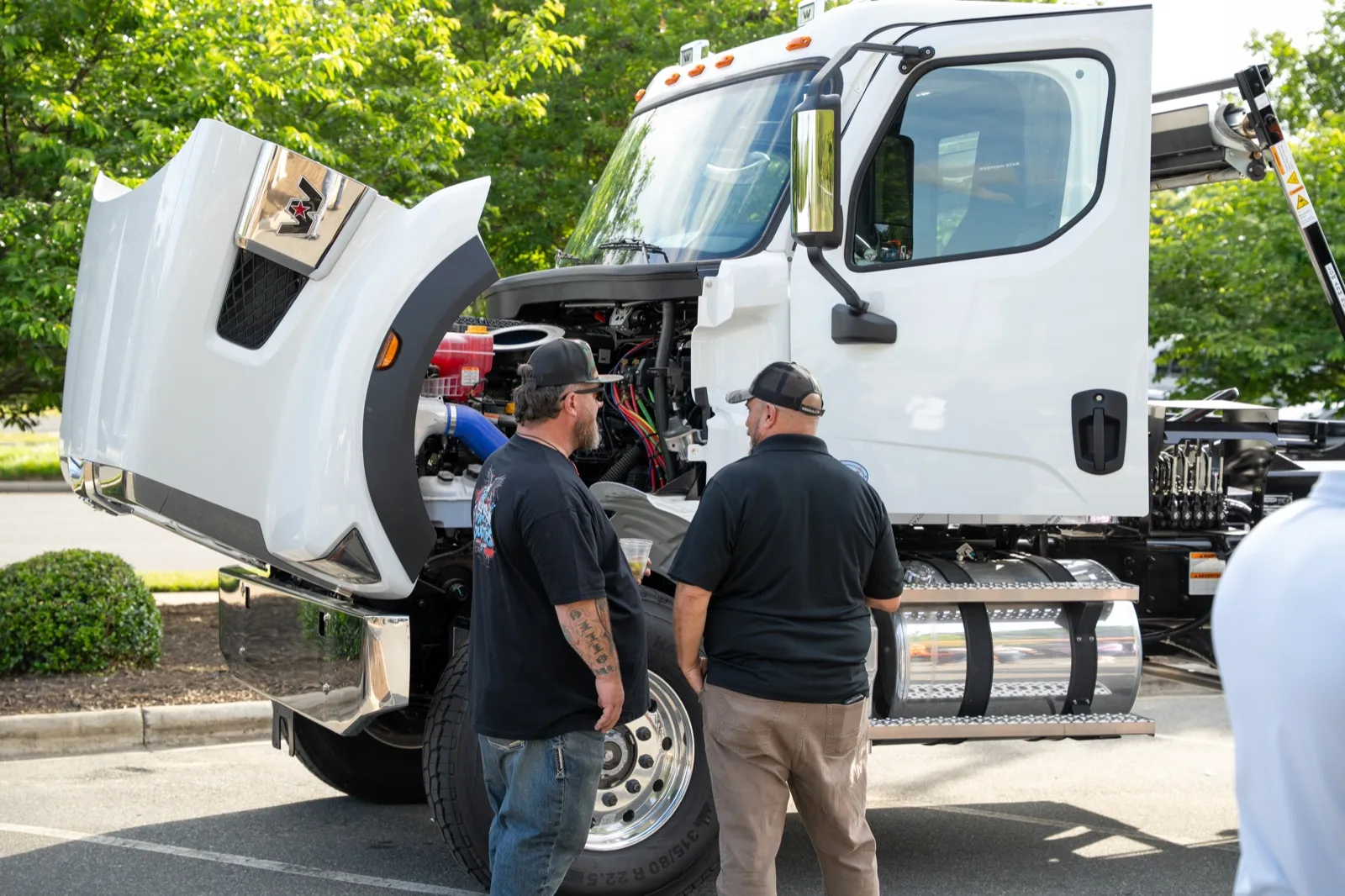 IWA members inspecting an affiliate's truck at the kickoff
